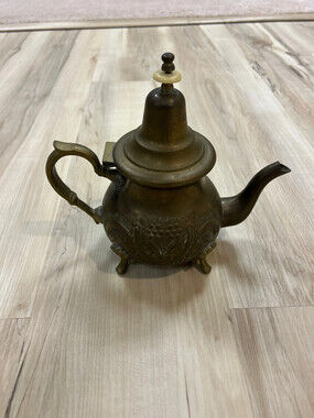 Vintage Moroccan brass teapot with ornate engravings